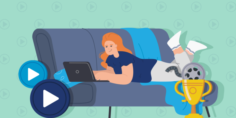 Woman with laptop on the couch, play button icons and trophy with a movie tape next to her